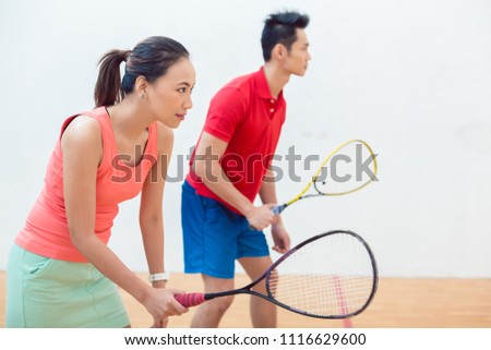 Competitive Chinese Woman Holding The Racquet During A Squash Game Foto d'archivio © Kzenon