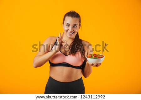 [[stock_photo]]: Image Of Caucasian Overweight Woman In Tracksuit Eating Green Sa