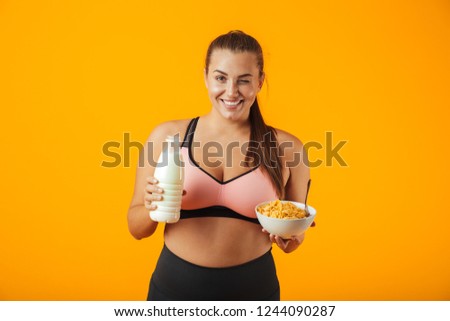 Foto stock: Image Of Happy Chubby Woman In Tracksuit Holding Milk And Corn F