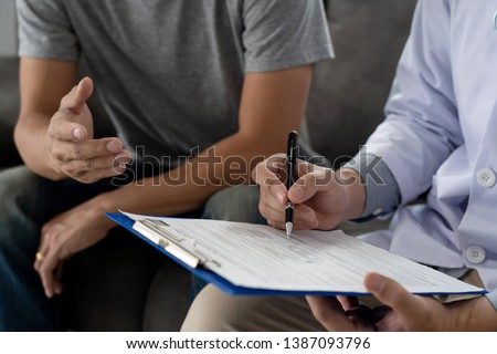 [[stock_photo]]: Male Patient With Hearing Problem Visiting Doctor Otorhinolaryng