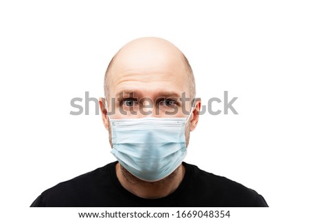 Stock photo: Young Adult Bald Head Man Wearing Respiratory Protective Medical Mask