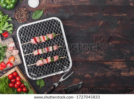 Сток-фото: Raw Pork Kebab With Paprika On Disposable Coal Bbq Grill With Fresh Vegetables On Wooden Background