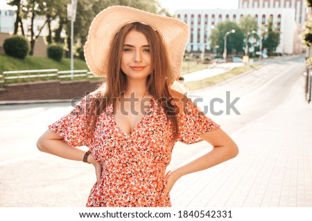 Stockfoto: Portrait Of A Sexy Young Female Smiling In A Park And Looking At