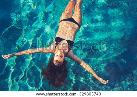 Сток-фото: Beautiful Young Woman Enjoying Swimming In Refreshing Sea Water