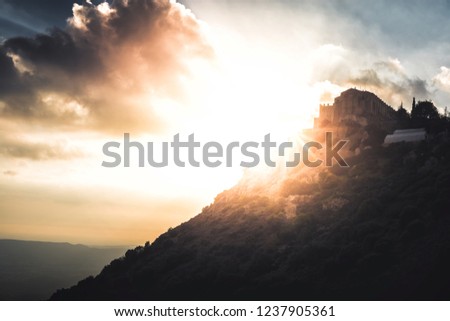 [[stock_photo]]: Silhouette Of Stavrovouni Monastery At Sunset Larnaca District