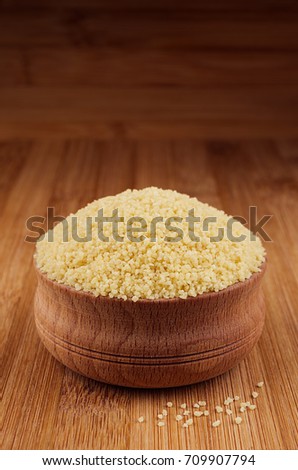 Stock fotó: Couscous In Wooden Bowl On Brown Bamboo Board Closeup Healthy Dietary Groats Background