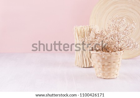 Foto stock: Soft Home Decor Of Beige Bamboo Dish Twigs And White Small Flowers In Ceramic Vase On White Wood B