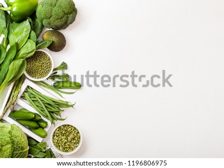 Foto stock: Assorted Green Toned Raw Organic Vegetables On White Background Avocado Cabbage Broccoli Caulifl