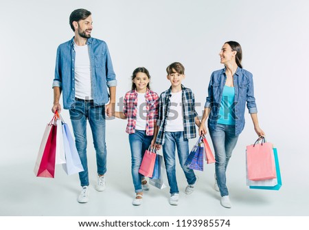 Foto stock: Portrait Full Length Of Happy Woman Holding Paper Shopping Bag In Hands And Jumping Posing At Camer