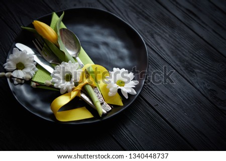 Foto d'archivio: Easter Spring Table Dishware Composition With Yellow Tulip Flower