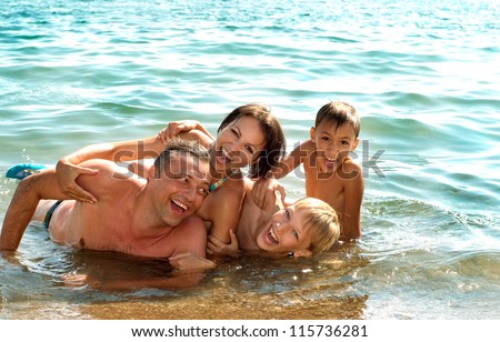 [[stock_photo]]: Dad And Son In The Background Of Tropical Beach Landscape Panorama Beautiful Turquoise Ocean Waives