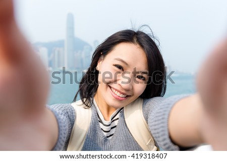 Stock fotó: Young Woman Taking Photos Of Victoria Harbor In Hong Kong China