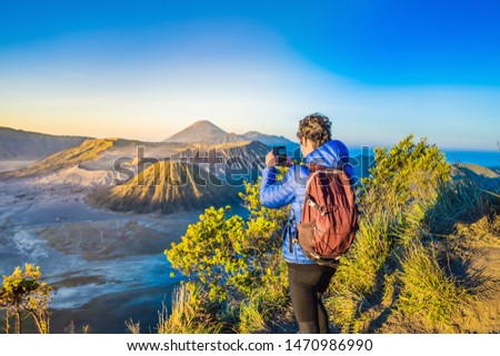 Stockfoto: Young Man Meets The Sunrise At The Bromo Tengger Semeru National Park On The Java Island Indonesia