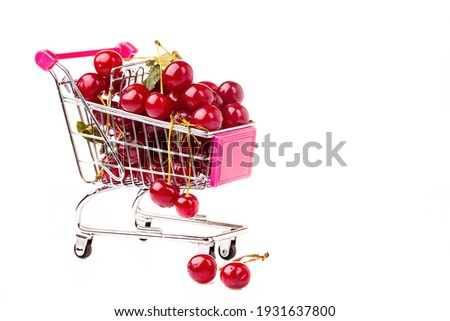 Foto stock: Shopping Cart Full Of Ripe Cherries Healthy And Nutritious Shopping Full Of Vitamins To Feed Childr