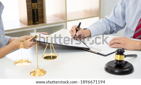 [[stock_photo]]: Client With His Partner Lawyers Or Attorneys Discussing Discussi