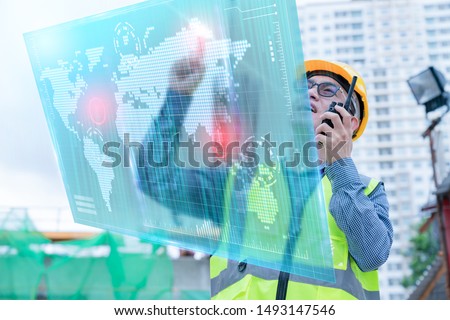 Foto d'archivio: Young Businessman With Helmet Drawing On Virutal Screen