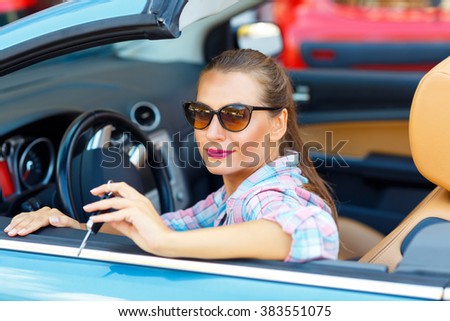 Stock fotó: Woman Sitting In A Convertible Car With The Keys In Hand - Conce