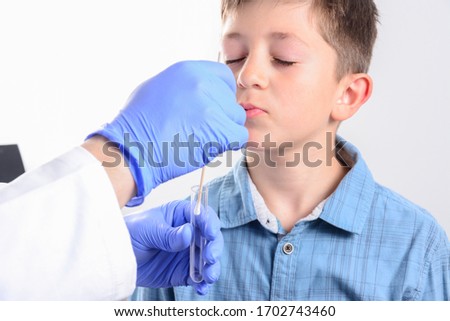 Foto d'archivio: Female Medical Specialist Holding Buccal Cotton Swab And Test Tu