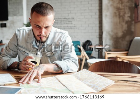 Zdjęcia stock: Young Man Drinking Coffee While Visiting The Business District O