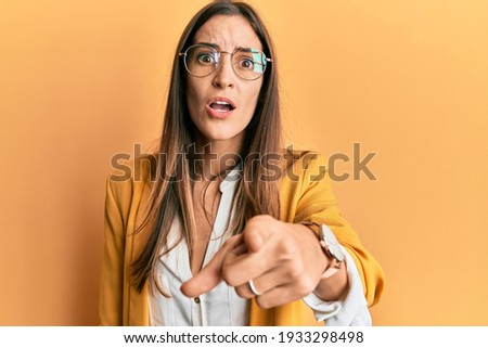 Stock foto: Displeased Blonde Business Woman Looking At Camera With Crossed Arms