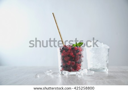 ストックフォト: Closeup Of A Freshly Prepared Milky Berry Vitamin Smoothie With Chia Seeds And Mint Leaves On A Gray