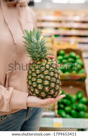 Stock fotó: Female Nutritionist Hold Pineapple In Her Hands On White Background