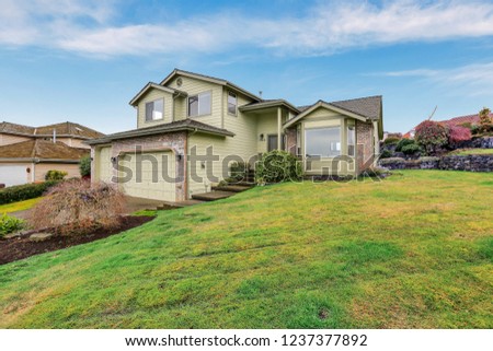 Foto stock: American Northwest Winter Time Home Exterior With Beige Color And Brick