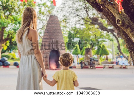 Stockfoto: Mother And Son Tourists Look At Wat Chalong Is The Most Important Temple Of Phuket