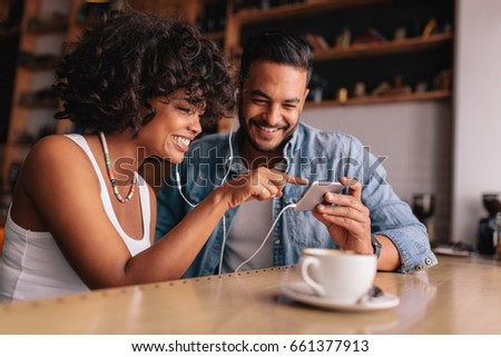 Stock fotó: Beautiful Mixed Race Woman Sitting In A Coffee Shop Using Her La