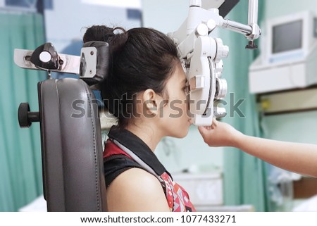 Stock photo: Anonymous Doctor Testing Eyes Of Woman
