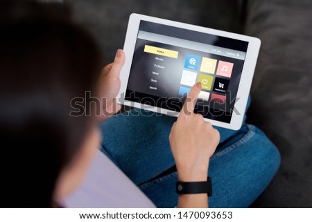Zdjęcia stock: Human Pointing At Icon On Touchpad Display While Choosing Something To Watch