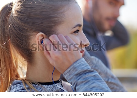 Stock photo: Happy Couple With Earphones Running Outdoors