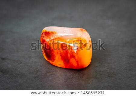 Foto d'archivio: Dark Orange Gemstone Isolated On White