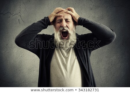 [[stock_photo]]: Negative Elderly Grey Haired Bearded Man