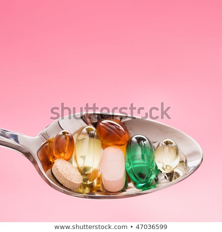 Ezüstkanál tele gyógyszer tablettával Stock fotó © iofoto
