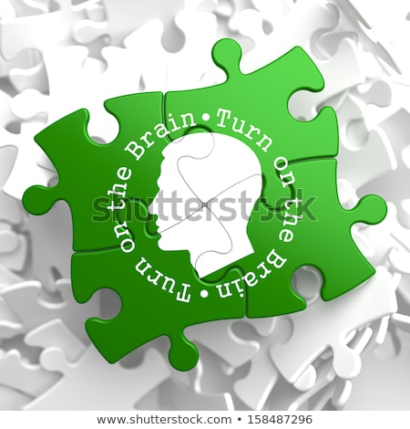 Turn On The Brain Green Puzzle Pieces [[stock_photo]] © Tashatuvango