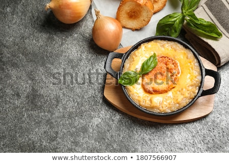 Foto d'archivio: French Onion Soup Served In A Bread Bowl