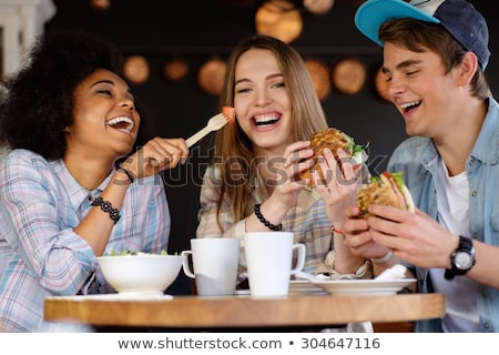 Foto stock: Teen Girls Eat Sandwiches
