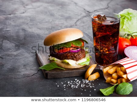 Сток-фото: Fresh Beef Burger With Sauce And Vegetables And Glass Of Cola Soft Drink With Potato Chips Fries In