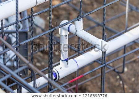 Stock photo: Newly Installed Pvc Plumbing Pipes And Steel Rebar Configuration