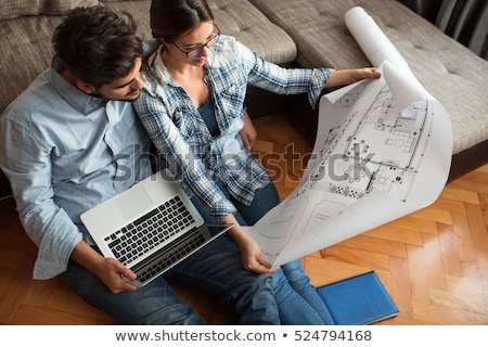 Foto stock: Architect Looking To A House Plan