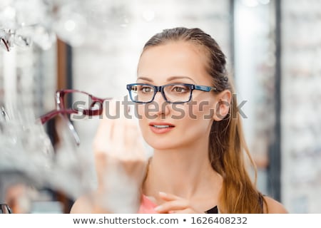 Stock foto: Woman Being Satisfied With The New Eyeglasses She Bought In The Store