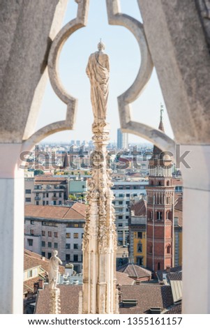 Stock photo: View From Roof Of Duomo To Spire With Statue And Sityscape Of Mi