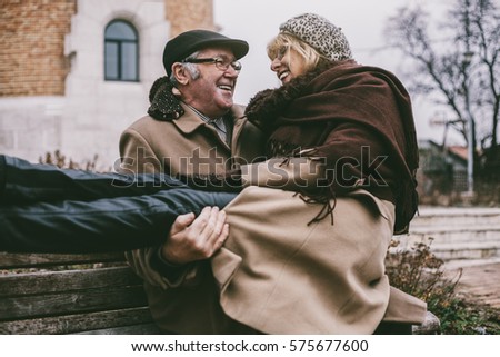 Stockfoto: Rear View Of Active Senior Caucasian Man Kissing Senior Caucasian Woman In The Park