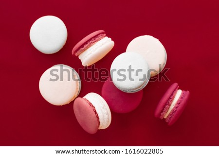 Сток-фото: French Macaroons On Wine Red Background Parisian Chic Cafe Dess