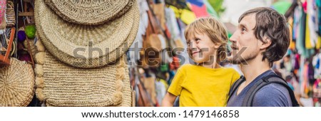 ストックフォト: Banner Long Format Boy At A Market In Ubud Bali Typical Souvenir Shop Selling Souvenirs And Handi