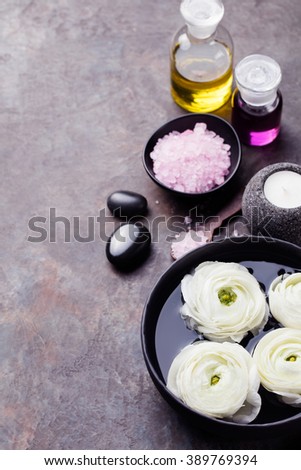 [[stock_photo]]: Spa And Wellness Massage Setting Still Life With Essential Oil Salt Stones And Cinnamon Candle