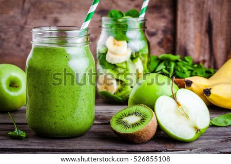 Сток-фото: Freshly Blended Green Apple Fruit Smoothie In Glass Jars With Straw Mint Leafs Cut Apples Top Vie