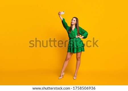 Stockfoto: Girl Making Selfie By The Smartphone On The Background Of The Bl