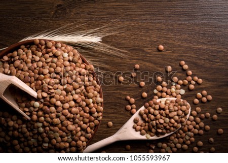 Zdjęcia stock: Lentils In Wooden Bowl And Spoon Groats In Wood Dish And Shovel